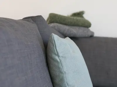 a group of pillows sitting on top of a couch at The Sandbox in Hayle