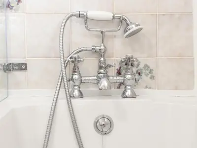 a shower in a bathroom with a white sink at Myrtle Cottage in Hayle