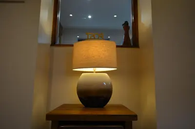 a lamp sitting on a table in a room at White Hart Cottage, Menheniot, Nr Looe in Menheniot