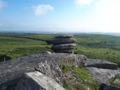 a stack of rocks sitting on top of a mountain at White Hart Cottage, Menheniot, Nr Looe in Menheniot