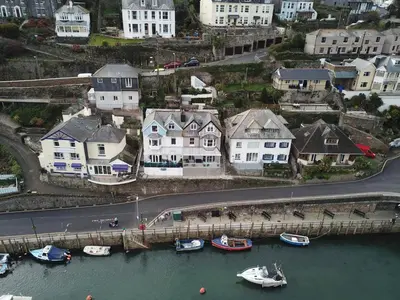a group of houses and boats in a harbor at Shellseekers Guest House in Looe