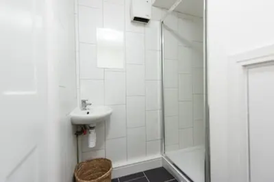 a bathroom with a sink and a shower at Kerensa in Portreath