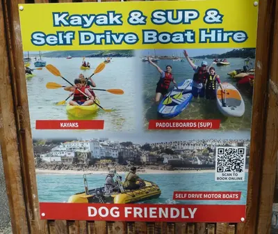 a sign for kayak and sup self drive boat hire at The Grey Mullet Guest House in St Ives
