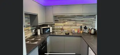 a kitchen with a sink and a microwave at 128 Hengar Manor in Bodmin