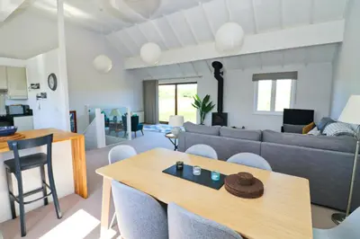 a living room with a couch and a table at Peaceful, rural cottage on the outskirts of Padstow in Padstow
