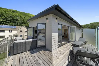 a small house with a deck with a view at The Cube in Portreath