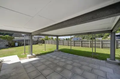 a white canopy over a patio with a yard at The Cube in Portreath