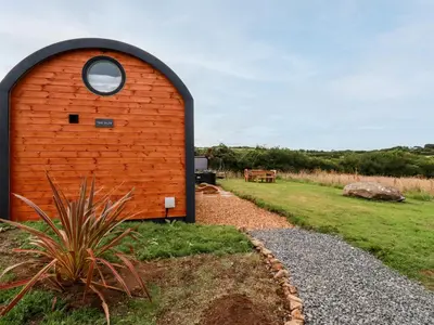 a red brick building with a round window at The Olju in Truro