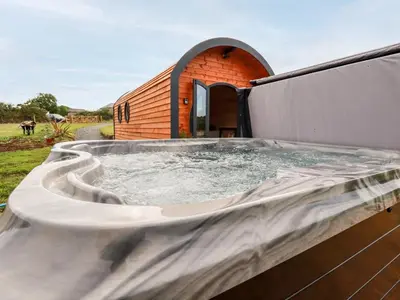 a large hot tub on the side of a building at Stargaze in Truro