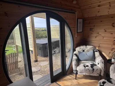 a room with a chair and a large window at Stargaze in Truro