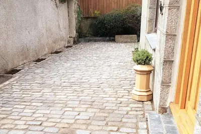 a potted plant sitting on the side of a building at High quality detached house with parking St. Ives in St Ives