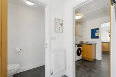 a bathroom with a toilet and a sink at Rosevilla Farmhouse in Portreath