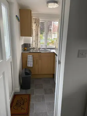 a small kitchen with a sink and a window at 24trenance in Newquay