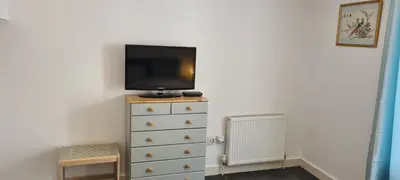 a bedroom with a tv on top of a dresser at Fore Street Bodmin in Bodmin