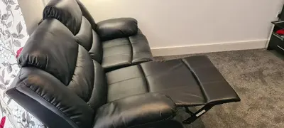 a black leather reclining chair and a foot stool at Fore Street Bodmin in Bodmin