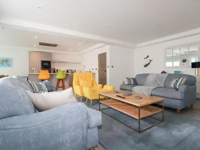 a living room with two couches and a coffee table at 30 Cliff Edge in Newquay