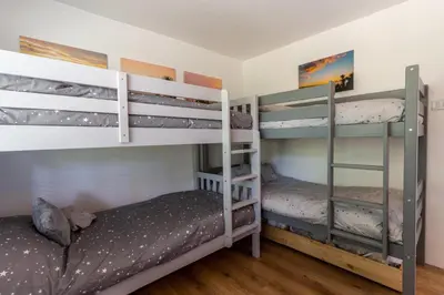 a bedroom with two bunk beds in a room at Finest Retreats - Avalon Sea Views in Downderry