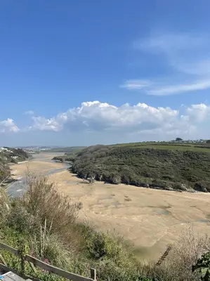 a view of a river from the top of a hill at 1 Chatsworth Riverscape Apartments - Riverview apartment in great location with free parking overlooking the Gannel just a short walk from Newquays incredible beaches and local amenities in Newquay