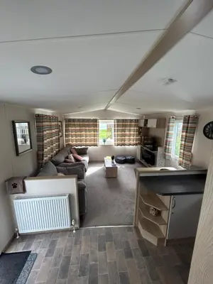 a living room with a couch and a table at Tranquil Retreat at River Valley Country Park in Penzance