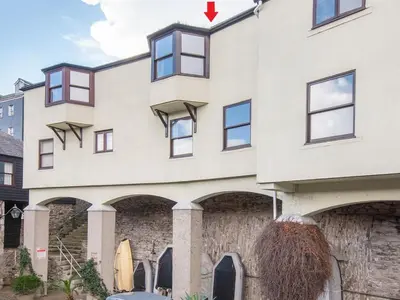a white building with a red arrow pointing at it at 4 Bedroom Cottage with panoramic Harbour views in Falmouth