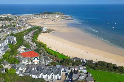 an aerial view of a beach with houses and the ocean at Sea Bre in St Ives