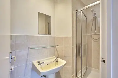 a bathroom with a sink and a shower at Howlyek, in St Agnes Village in St. Agnes