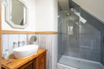 a bathroom with a sink and a shower at Daydreamer Cottage in Padstow