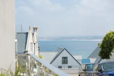 a view of the ocean from the balcony of a house at The Point in St Ives