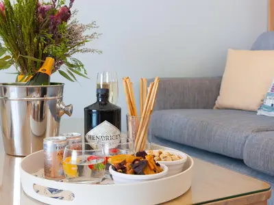 a table with a tray of food and a bottle of wine at Ivory in St Ives