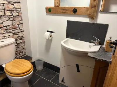a bathroom with a toilet and a sink at The Mill'ouse in Launceston