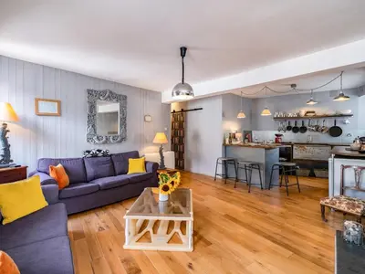 a living room with a couch and a table at Pibbies in Port Isaac