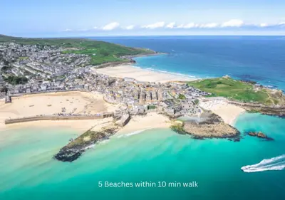 an aerial view of a beach and the ocean at Karibu - Boutique Cottage with Parking - Short walk to Beach in St Ives