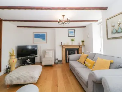 a living room with a couch and a tv at Meledor in Marazion