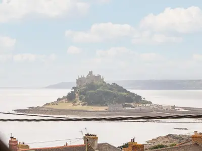a castle on an island in the water at Marazion Attic in Marazion