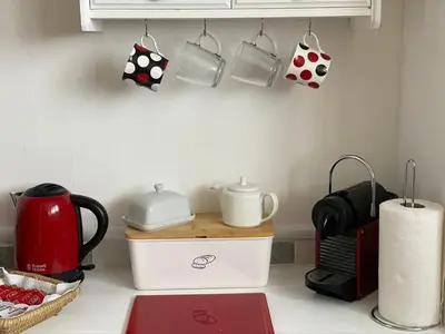 a kitchen counter with utensils on a counter top at Shazzamm in Newquay