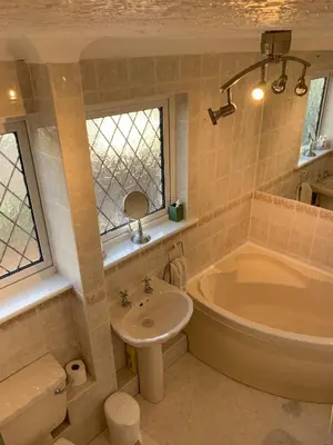 a bathroom with a tub and a sink and a toilet at Shazzamm in Newquay