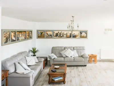 a living room with two couches and a table at Squirrels Dray in Saint Goran