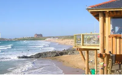 a view of a beach with people in the water at Ocean Gate in Newquay
