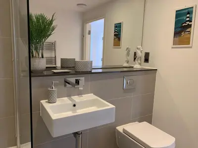 a bathroom with a sink and a toilet at Ocean Gate in Newquay