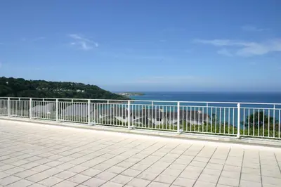 a balcony with a view of the ocean at Ocean Gem in Carbis Bay