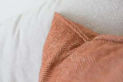 a close up of an orange tie on a white shirt at Ithaca in St Ives