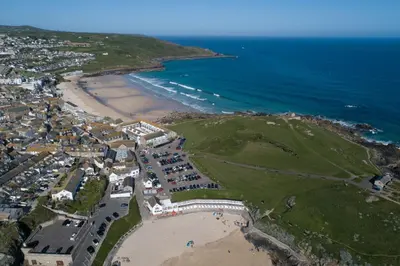 an aerial view of a beach and the ocean at Mariners Cottage, St Ives in St Ives