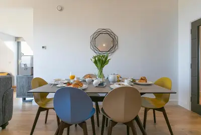 a dining room with a table and chairs at Sea Vista in Carbis Bay