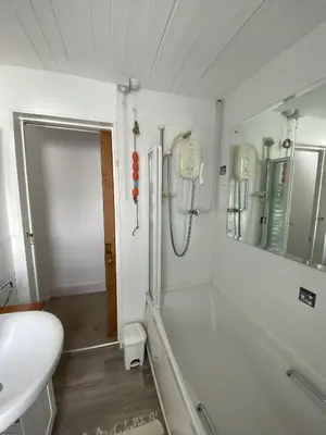 a bathroom with a shower and a sink at Frobisher Apartments in Falmouth