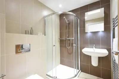 a bathroom with a shower and a sink at Halcyon Cove in Carbis Bay