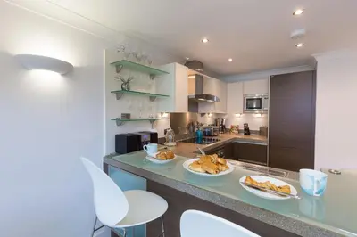 a kitchen with two plates of food on a counter at The Sanctuary in St Ives