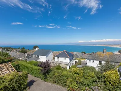 an aerial view of houses and the ocean at Shamal in Carbis Bay