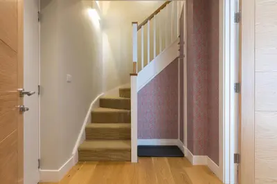 a staircase in a home with a stair case at The Pearl in St Ives