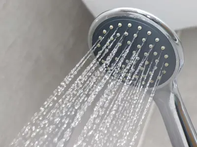 a shower head with water coming out of it at The View in St Ives