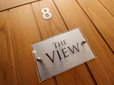 a sign that says the view on a wooden door at The View in St Ives